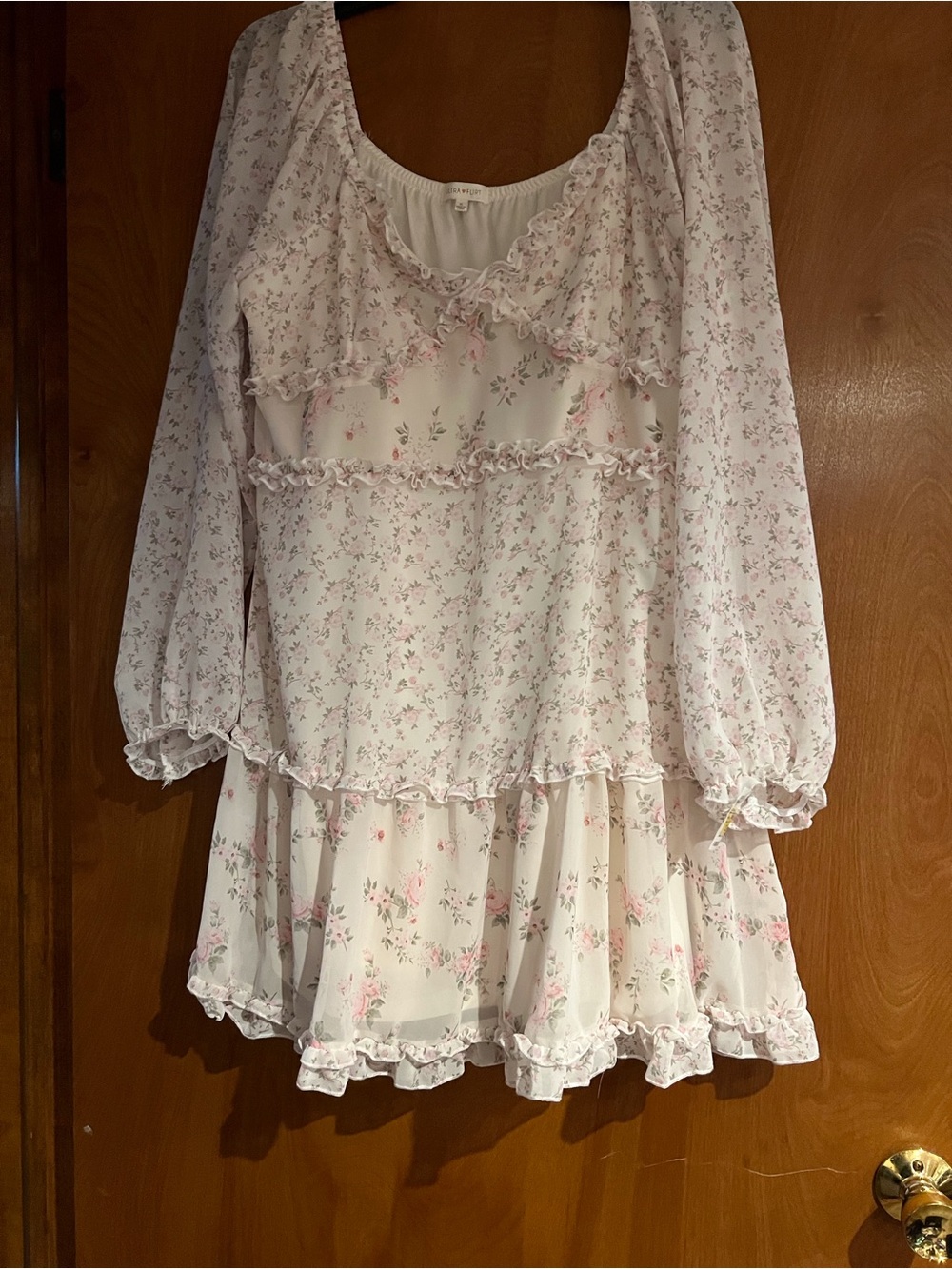 Ultra Flirt cream short dress ruffles and pink floral print.